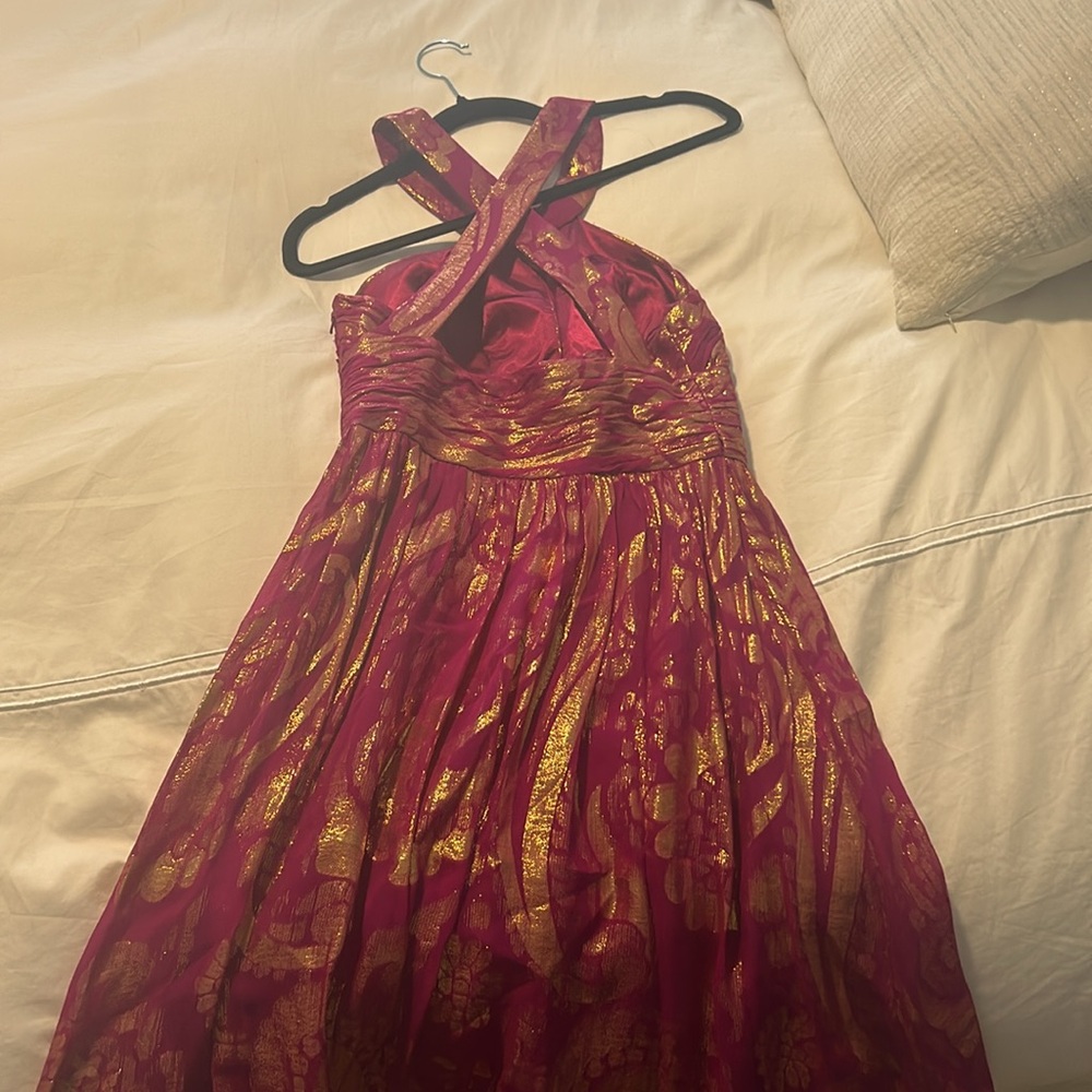 A cocktail dress that is perfect for a summer wedding or event.